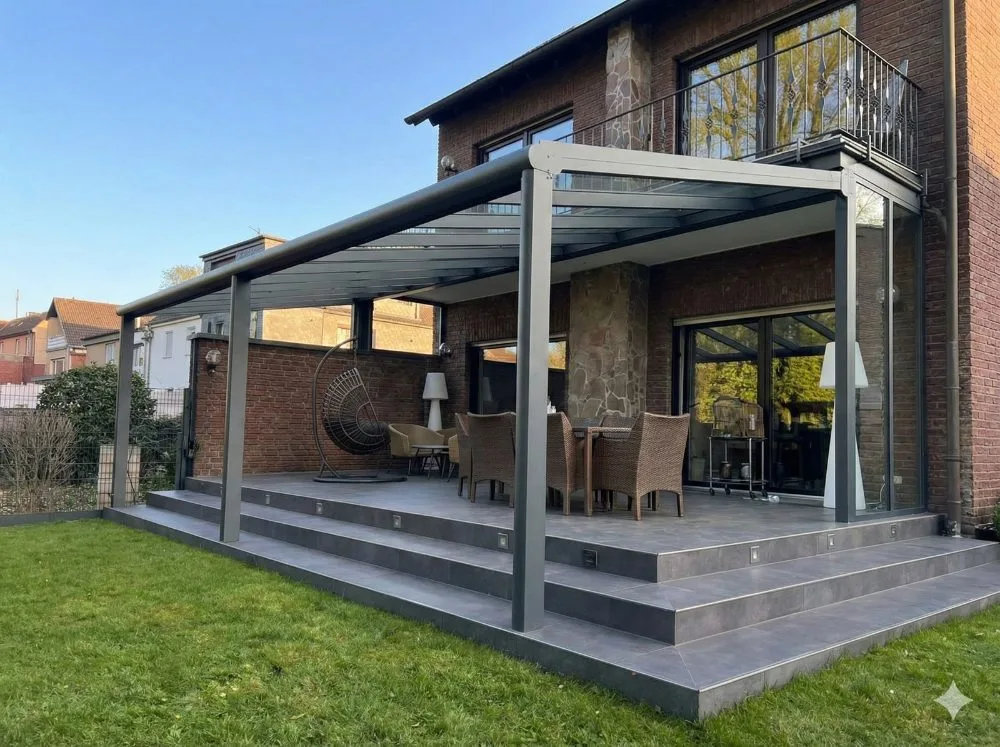 Glass canopy on aluminium beams protecting a building entrance